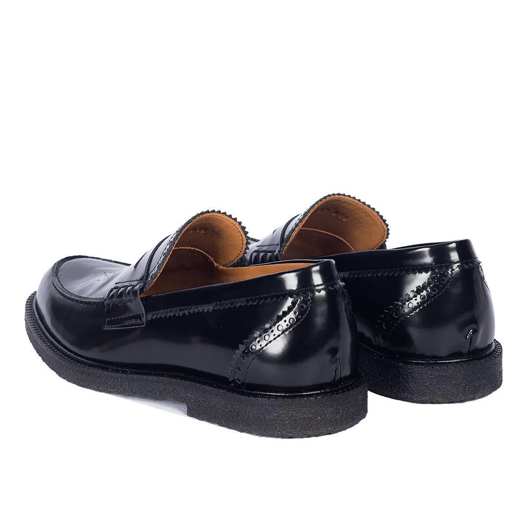 Penny loafer with decorative brogue pattern